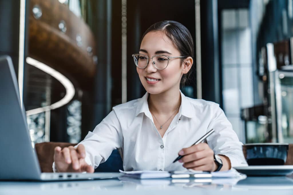 Business woman busy working on laptop computer