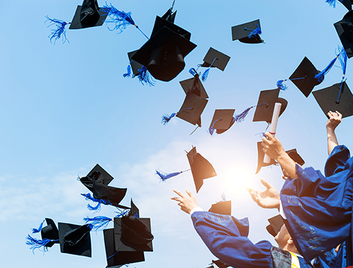 graduation caps filling the sky